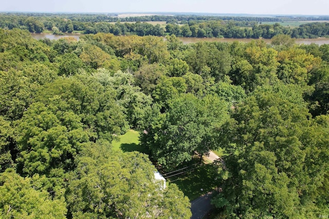 birds eye view of property with a forest view