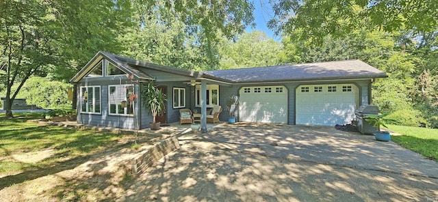 view of front facade with aphalt driveway and a garage