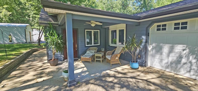 exterior space featuring a garage, an outbuilding, a storage shed, and a ceiling fan