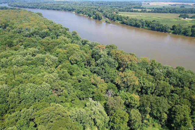 aerial view with a forest view and a water view