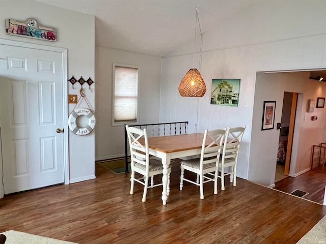 dining area with wood-type flooring