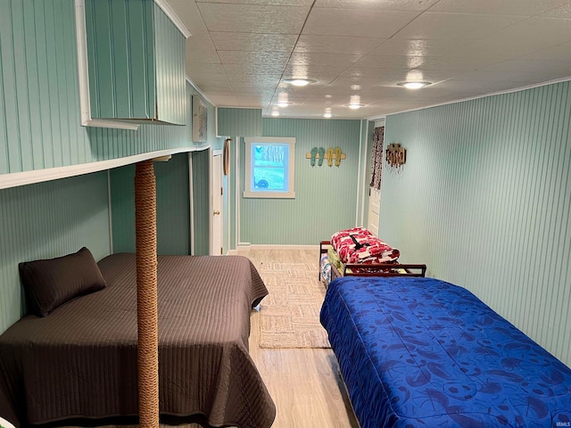 bedroom with wood-type flooring