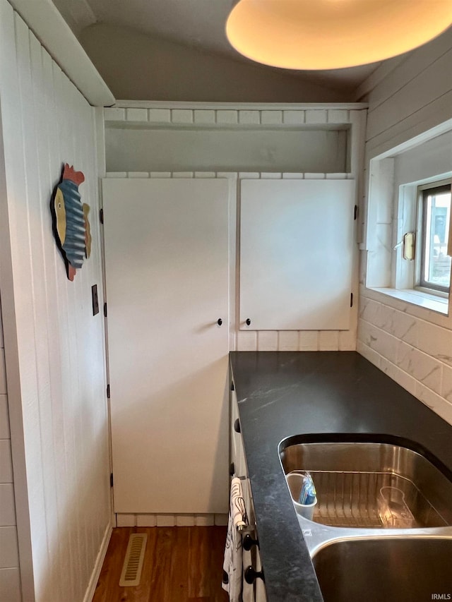 kitchen featuring hardwood / wood-style flooring and sink