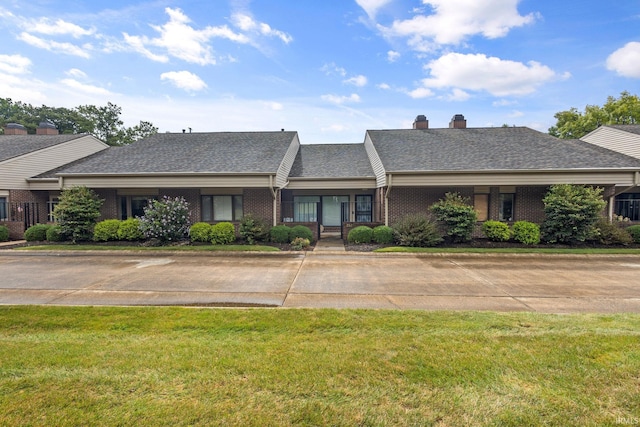 ranch-style house with a front lawn