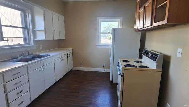 715 Osage St, Fort Wayne, IN 46808 - kitchen featuring white range with electric cooktop, a sink, dark wood finished floors, and healthy amount of natural light