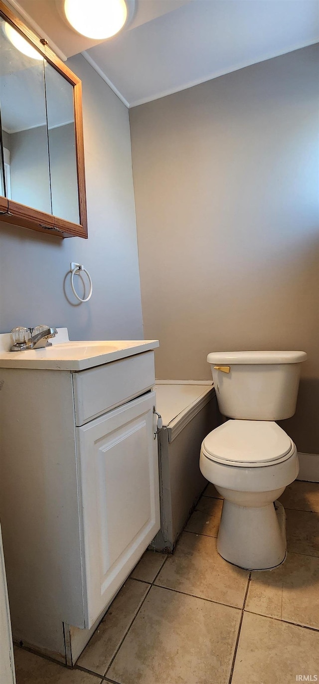 715 Osage St, Fort Wayne, IN 46808 - half bathroom with toilet, vanity, and tile patterned floors