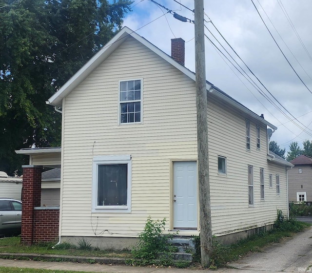 715 Osage St, Fort Wayne, IN 46808 - view of side of home featuring a chimney
