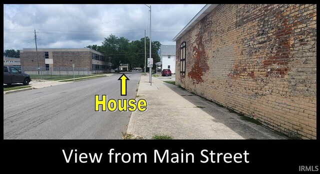 715 Osage St, Fort Wayne, IN 46808 - view of asphalt road featuring sidewalks, curbs, and street lights