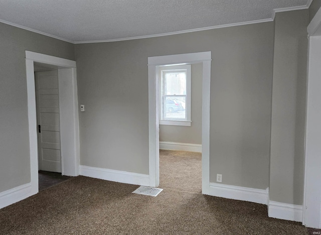 715 Osage St, Fort Wayne, IN 46808 - empty room with carpet flooring, crown molding, a textured ceiling, and baseboards