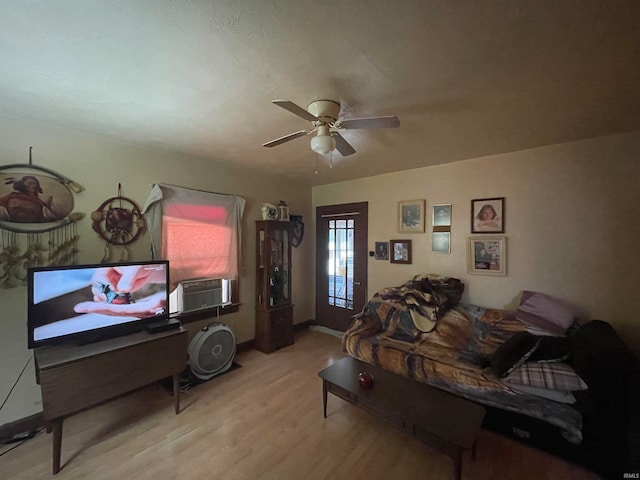 living room featuring ceiling fan, hardwood / wood-style flooring, and cooling unit