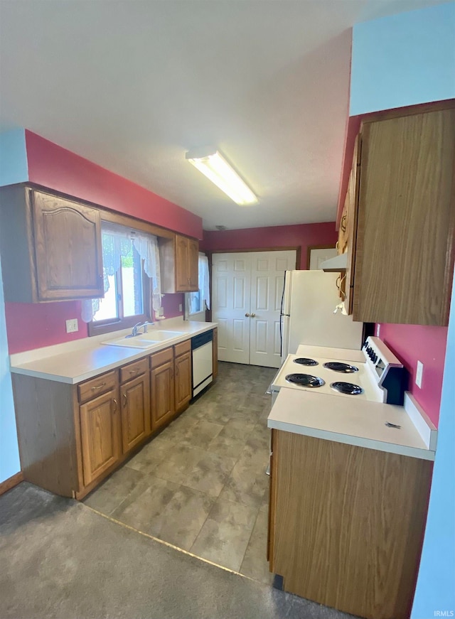 kitchen featuring light tile patterned flooring, sink, and white appliances