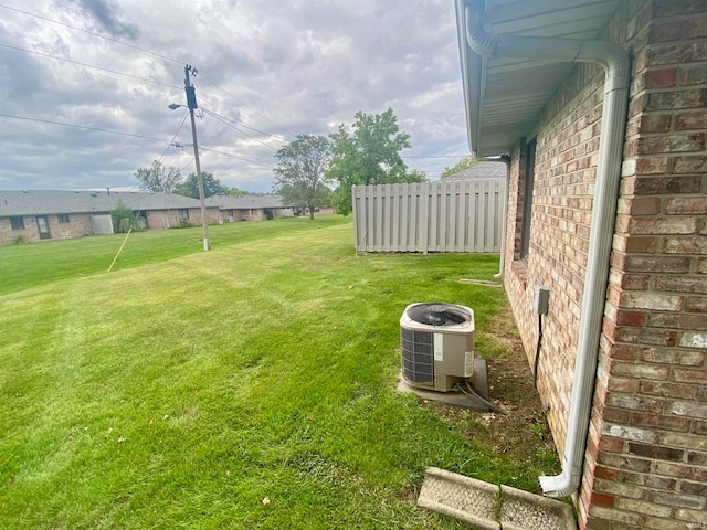 view of yard with central air condition unit