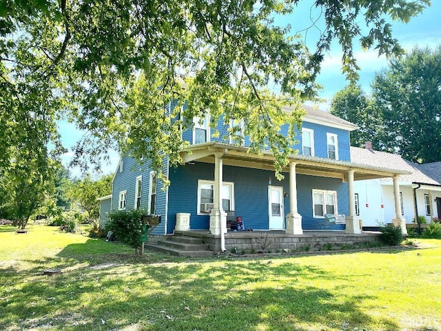 view of front of property featuring a porch and a front lawn