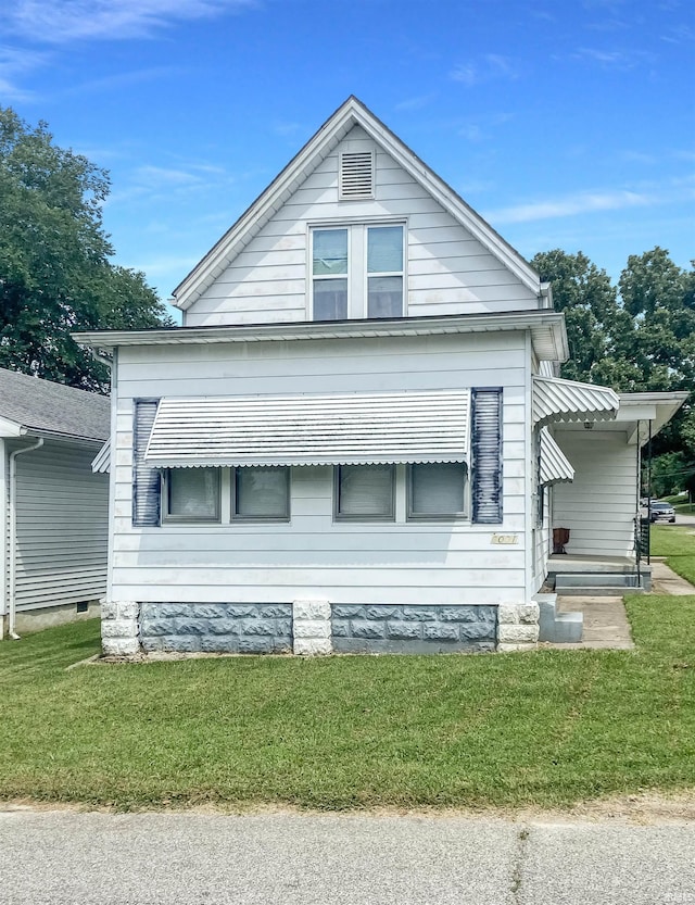 view of home's exterior with a lawn