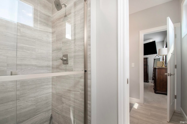 bathroom with a tile shower