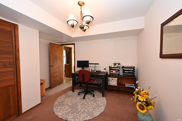 carpeted office with a notable chandelier