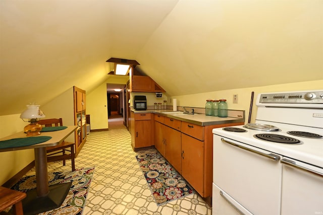 kitchen with sink, vaulted ceiling, light tile patterned floors, and white electric range