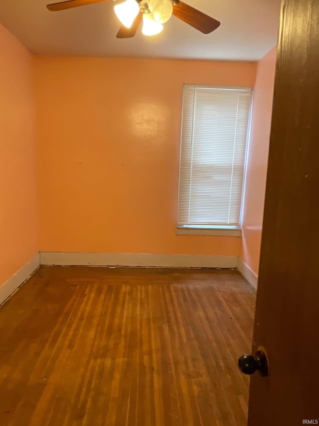 spare room featuring ceiling fan and wood-type flooring