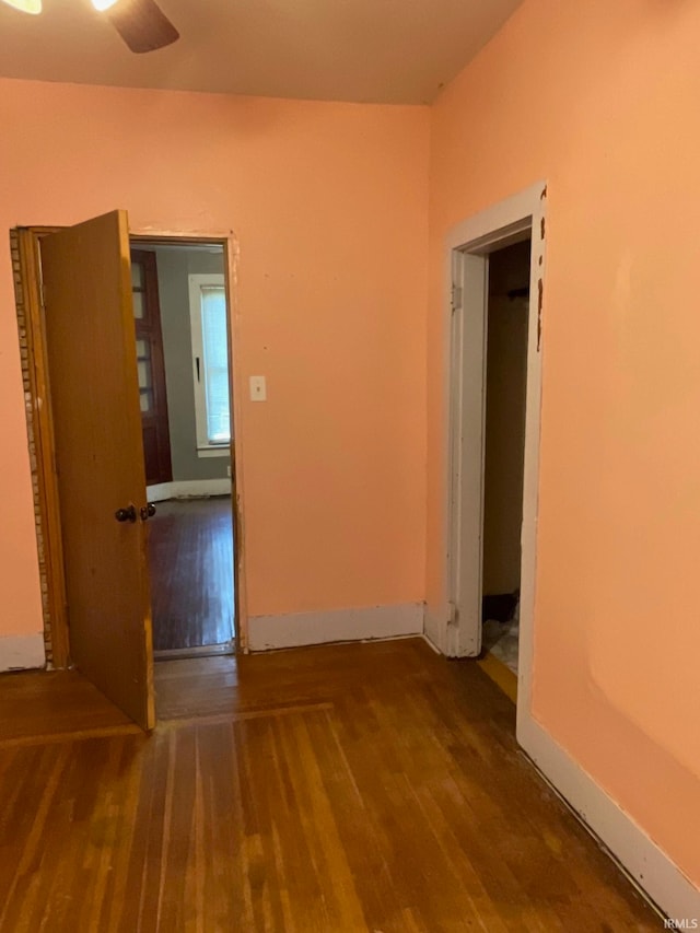 empty room with ceiling fan and hardwood / wood-style floors