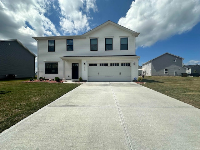 view of front of home with a garage and a front lawn