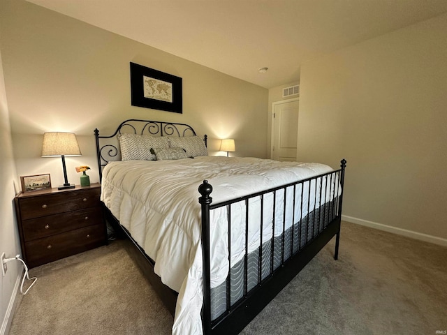 bedroom with light colored carpet