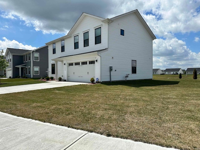 view of front of home featuring a garage and a front yard