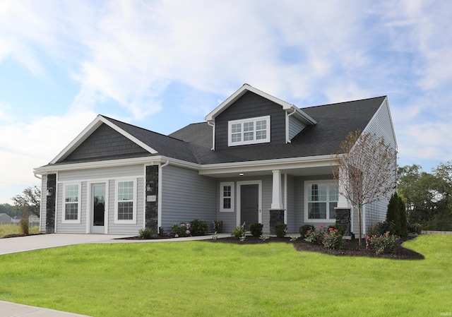 craftsman-style house with a front yard