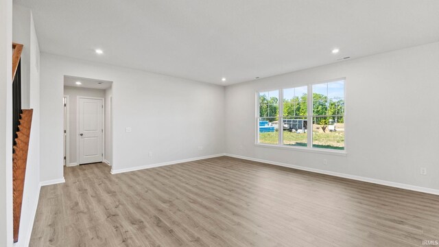 unfurnished room featuring light hardwood / wood-style flooring