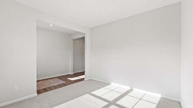 unfurnished room featuring hardwood / wood-style flooring