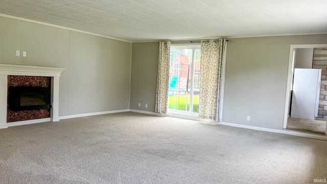 unfurnished living room with crown molding and carpet floors