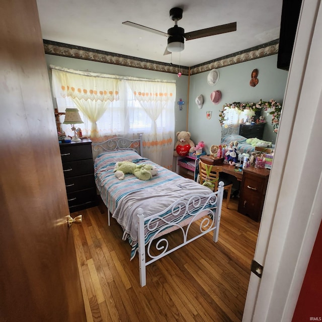 bedroom featuring ceiling fan and wood-type flooring