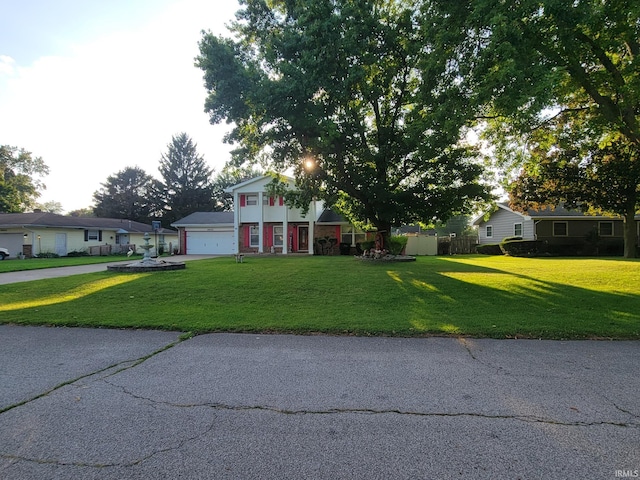 view of front of house featuring a garage and a front yard