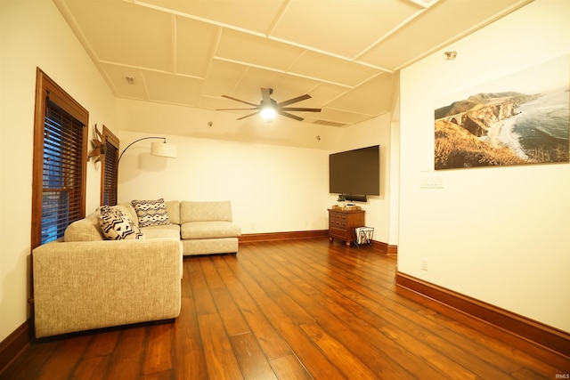 living room featuring dark wood-style floors, ceiling fan, and baseboards