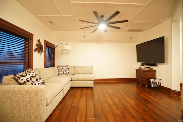 living area featuring ceiling fan, hardwood / wood-style floors, visible vents, and baseboards