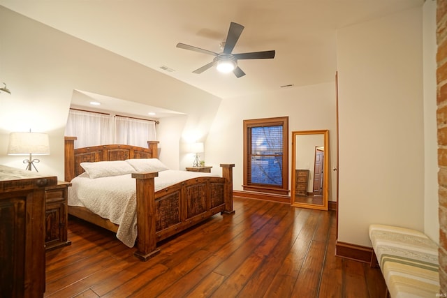 bedroom with ceiling fan, dark wood-type flooring, visible vents, and baseboards