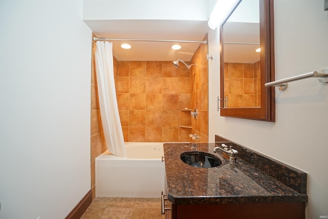 bathroom featuring tile patterned floors, shower / bathtub combination with curtain, and vanity