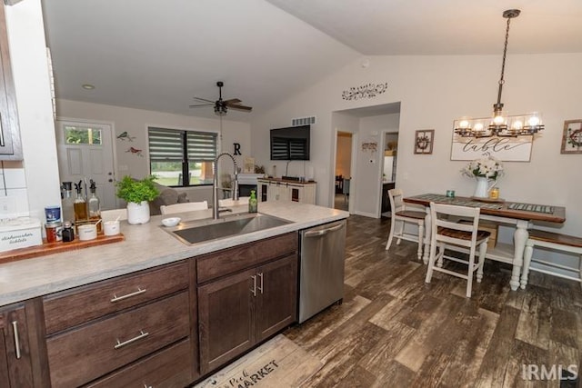 kitchen featuring dark wood-type flooring, ceiling fan with notable chandelier, dishwasher, sink, and lofted ceiling