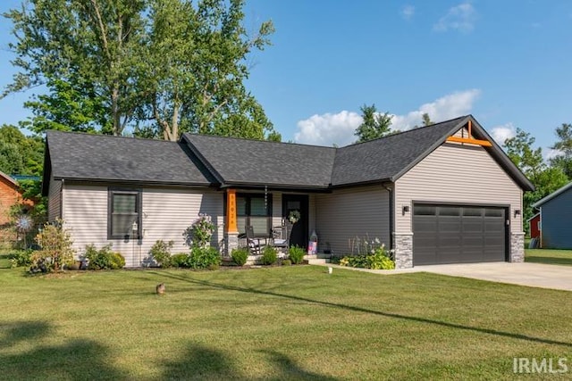 view of front facade with a garage and a front lawn