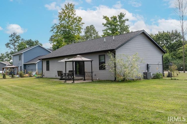 rear view of property featuring a yard and a patio