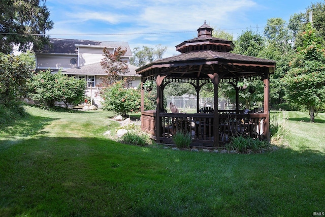 view of home's community with a gazebo and a yard