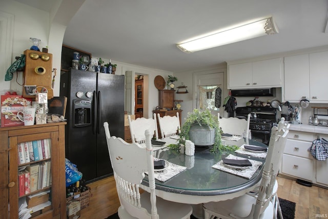 dining room with light wood-type flooring