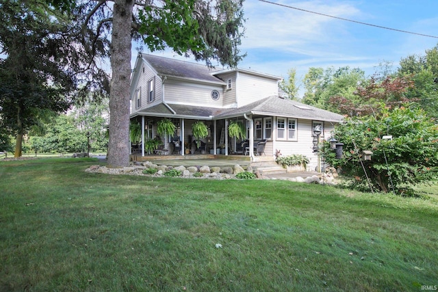 back of house featuring a yard