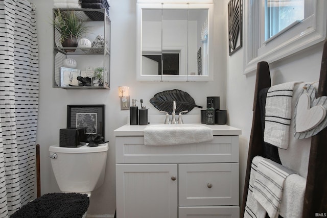 bathroom with vanity and toilet