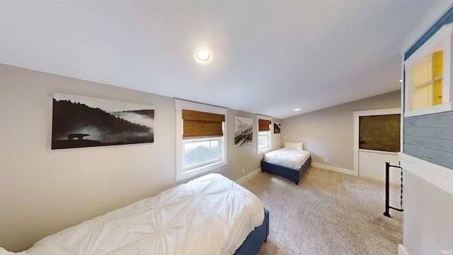 bedroom featuring carpet flooring and lofted ceiling