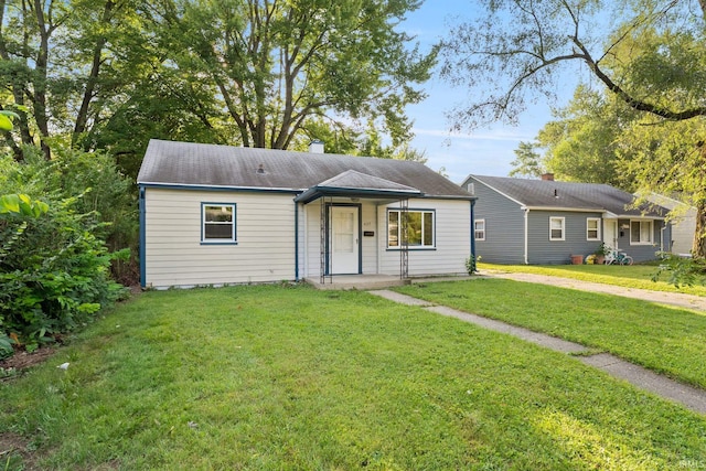 ranch-style house with a front lawn