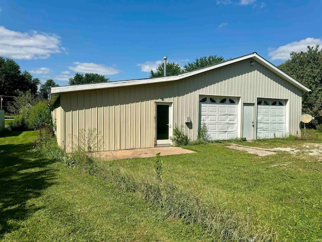 garage with a lawn