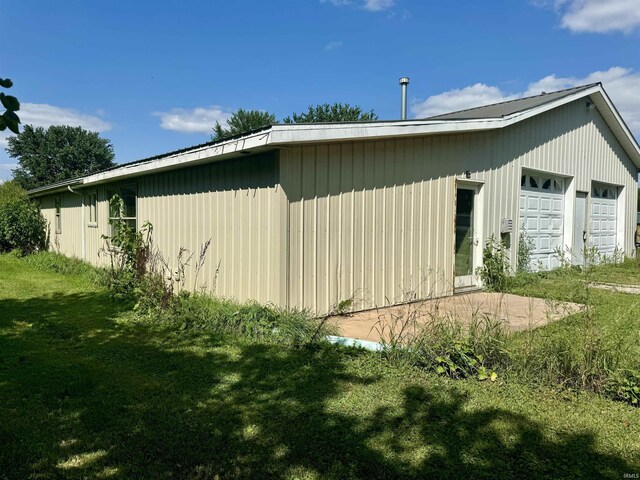 view of property exterior with a lawn