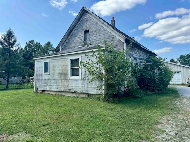 view of side of property featuring a yard