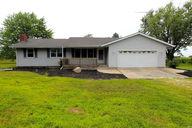 ranch-style home with a garage and a front lawn