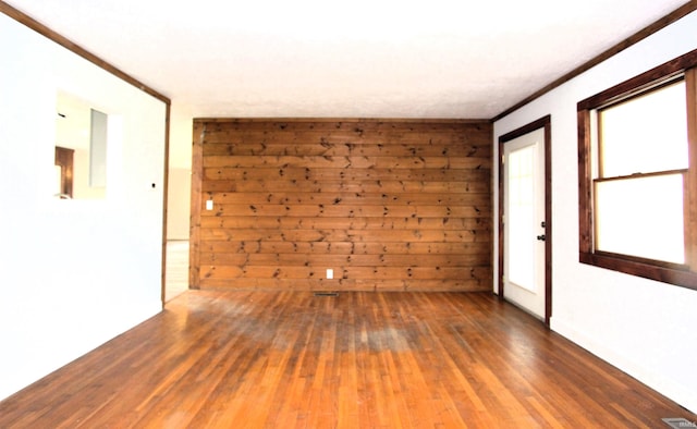 spare room featuring wood-type flooring